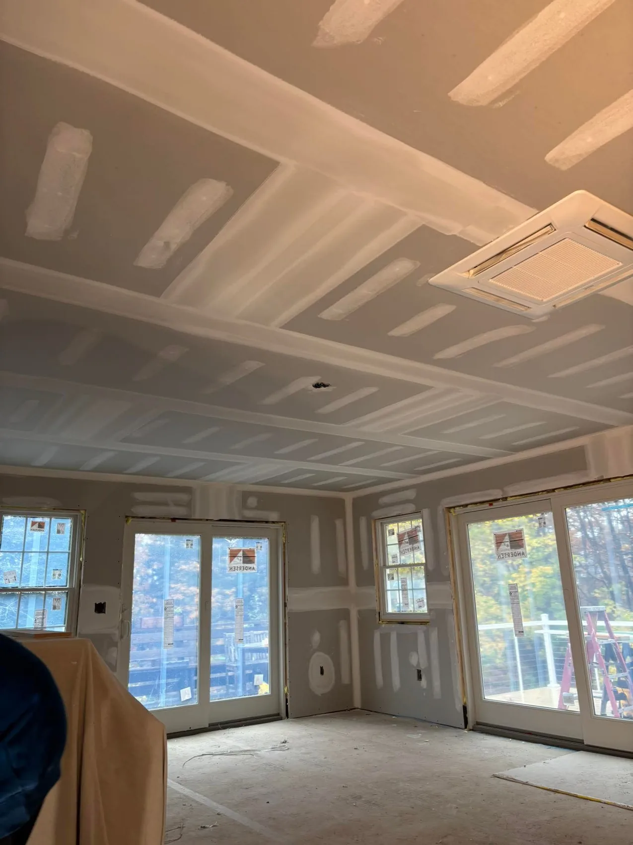 Large drywall project with finished seams and recessed ceiling details