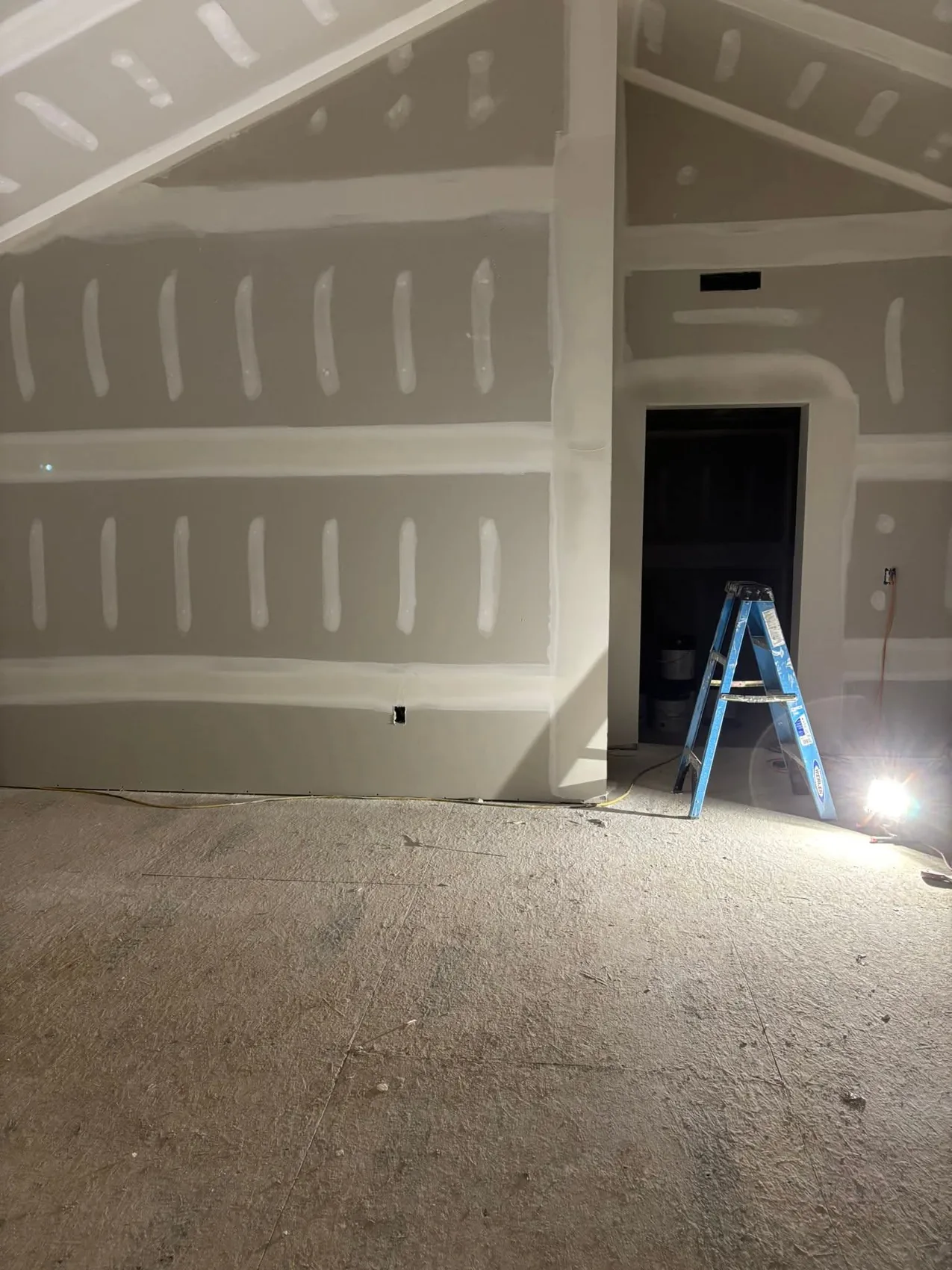 Finished vaulted drywall wall and ceiling