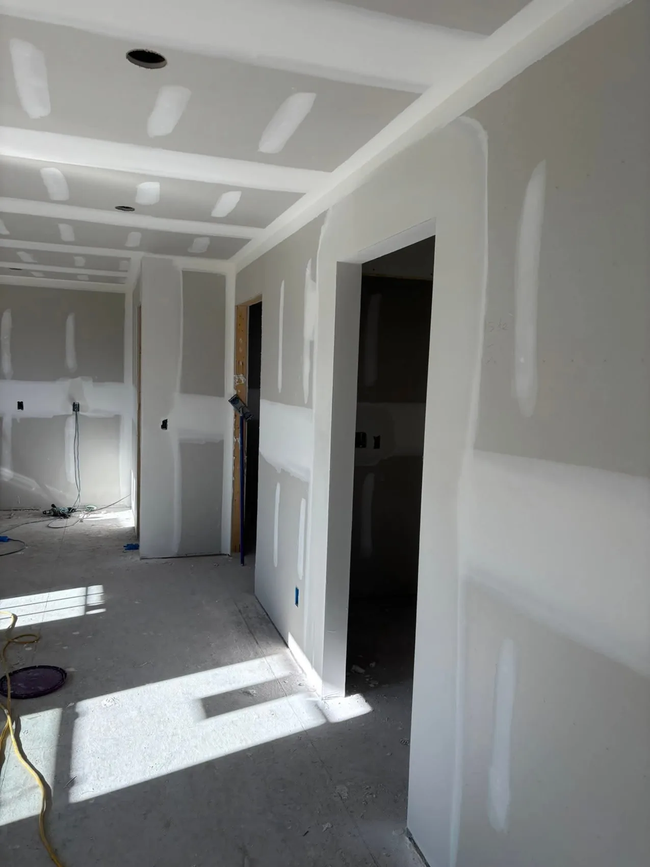 Finished drywall hallway with clean corners
